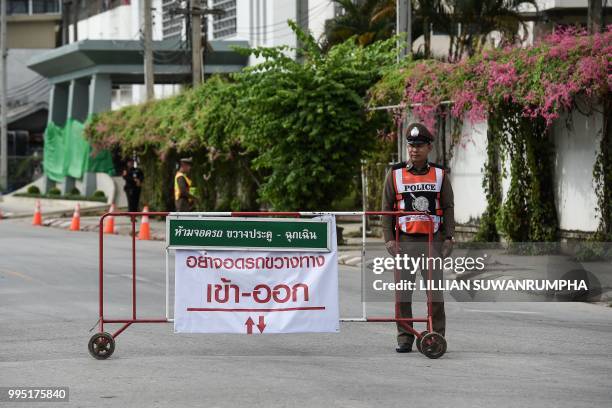 Thai policeman secures the hospital in Chiang Rai where the boys rescued from Tham Luang cave are being treated, in the northern Thai city of Chiang...