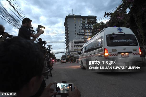 An ambulance transporting alleged members of the children's football team approaches the hospital in the northern Thai city of Chiang Rai on July 10,...