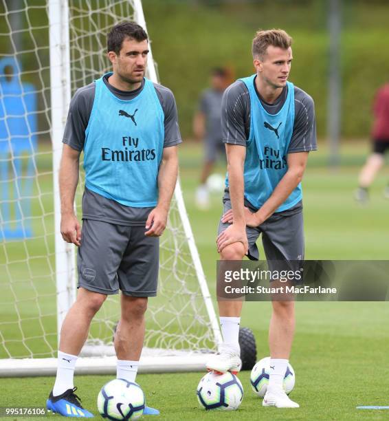 Sokratis and Rob Holding of Arsenal during a training session at London Colney on July 10, 2018 in St Albans, England.