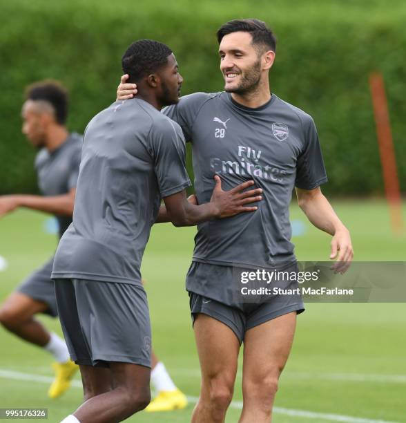 Ainsley Maitland-Niles and Lucas Perez of Arsenal during a training session at London Colney on July 10, 2018 in St Albans, England.