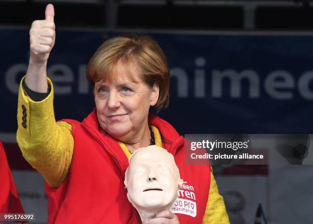 German chancellor Angela Merkel stands on stage in Greifswald, Germany, 23 September 2017. During the project week "resuscitation" of the Medical...