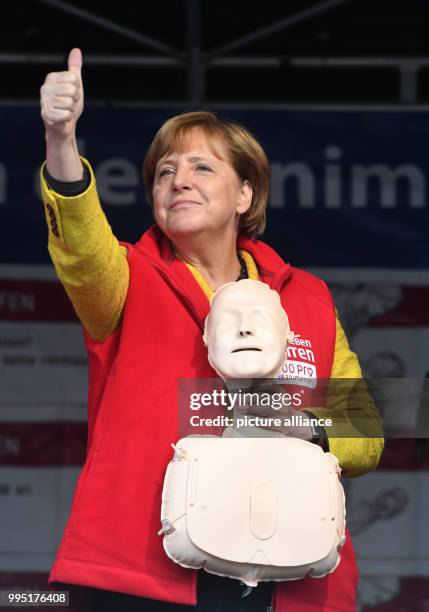 German chancellor Angela Merkel stands on stage in Greifswald, Germany, 23 September 2017. During the project week "resuscitation" of the Medical...