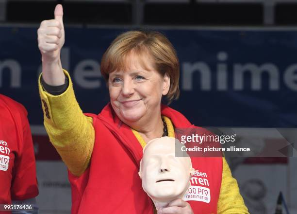 German chancellor Angela Merkel stands on stage in Greifswald, Germany, 23 September 2017. During the project week "resuscitation" of the Medical...