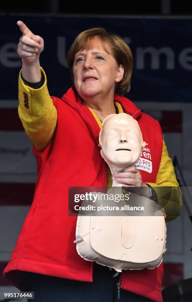 German chancellor Angela Merkel stands on stage in Greifswald, Germany, 23 September 2017. During the project week "resuscitation" of the Medical...