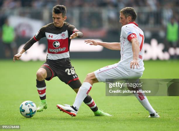 Pauli's Waldemar Sobota and Duesseldorf's Oliver Fink during the German 2nd Bundesliga match between FC St. Pauli and Fortuna Duesseldorf at the...