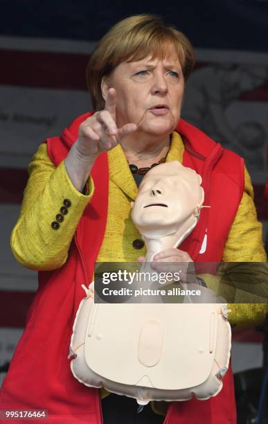 German chancellor Angela Merkel stands on stage in Greifswald, Germany, 23 September 2017. During the project week "resuscitation" of the Medical...