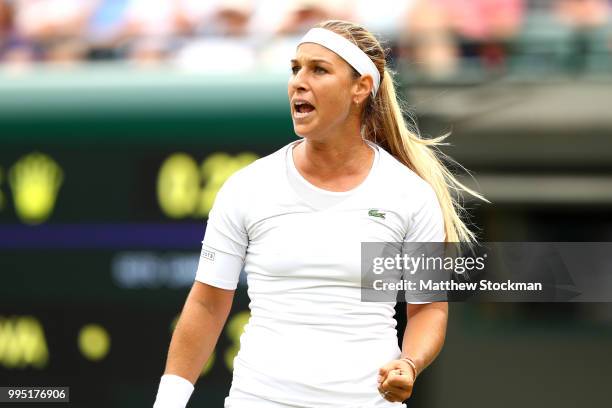 Dominika Cibulkova of Slovakia celebrates winning a point against Jelena Ostapenko of Latvia during their Ladies' Singles Quarter-Finals match on day...