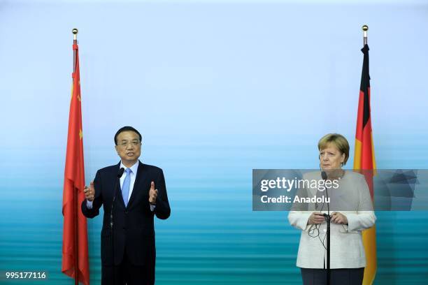 Chinese Premier Li Keqiang makes a speech during a press conference with German Chancellor Angela Merkel following a presentation on autonomous...