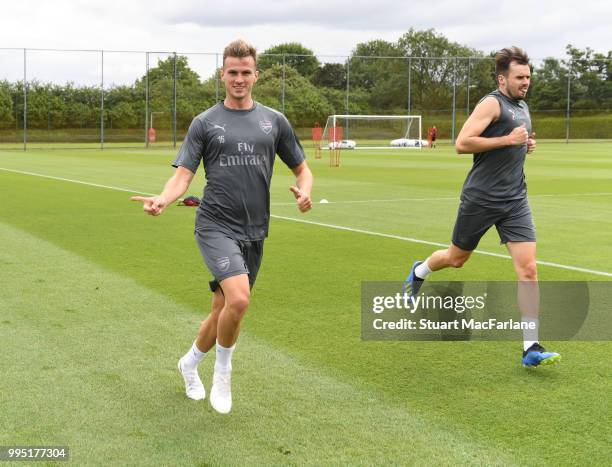 Rob Holding and Carl Jenkinson of Arsenal during a training session at London Colney on July 10, 2018 in St Albans, England.