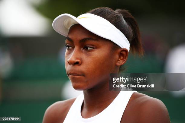 Cori Gauff of the United States looks on during her Girls' Singles second round match on day eight of the Wimbledon Lawn Tennis Championships at All...