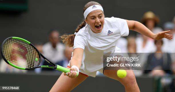 Latvia's Jelena Ostapenko returns against Slovakia's Dominika Cibulkova during their women's singles quarter-final match on the eighth day of the...