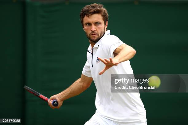 Gilles Simon of France plays a forehand against Juan Martin Del Potro of Argentina during their Men's Singles fourth round match on day eight of the...