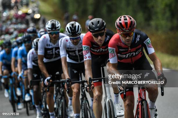 S BMC Racing cycling team riders, New Zealand's Patrick Bevin and US Tejay Van Garderen take a relay at the head of the pack chasing a four-men...