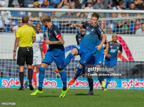 Hoffenheim's Dennis Geiger cheers over his 1-0 score during the German Bundesliga match between 1899 Hoffenheim and FC Schalke 04 at the...