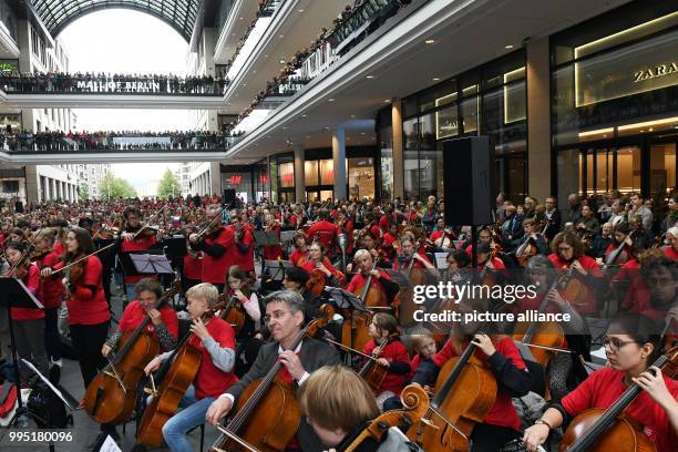 The German Symphony Orchestra performs at the "Symphonic Mob" event, Berlin's largest spontaneous orchestra at the Mall of Berlin, Germany, 23...