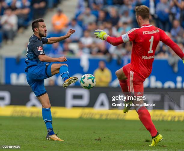 Schalke's goalkeeper Ralf Faehrmann fails to stop Hoffenheim's Lukas Rupp from scoring 1-0 during the German Bundesliga match between 1899 Hoffenheim...