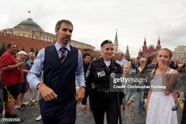 Gareth Southgate lookalike Neil Rowe causes a stir as football fans, TV crews and tourists mistake him for the real England manager as he tours Red...