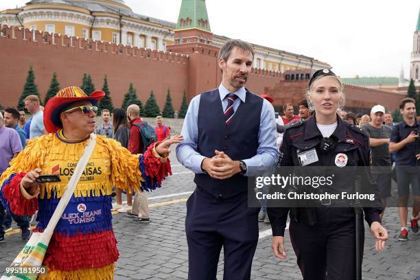 Gareth Southgate lookalike Neil Rowe causes a stir as football fans, TV crews and tourists mistake him for the real England manager as he tours Red...