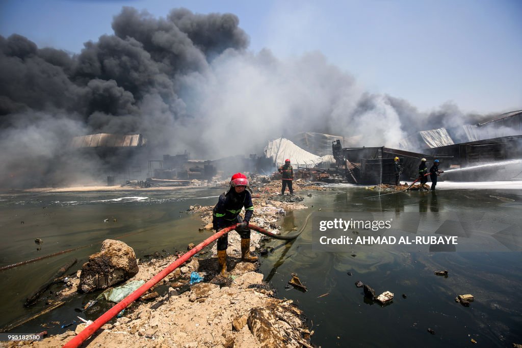 Iraq Fire Engine Iraqi firefighters attempt to put out a fire that broke out due to ...