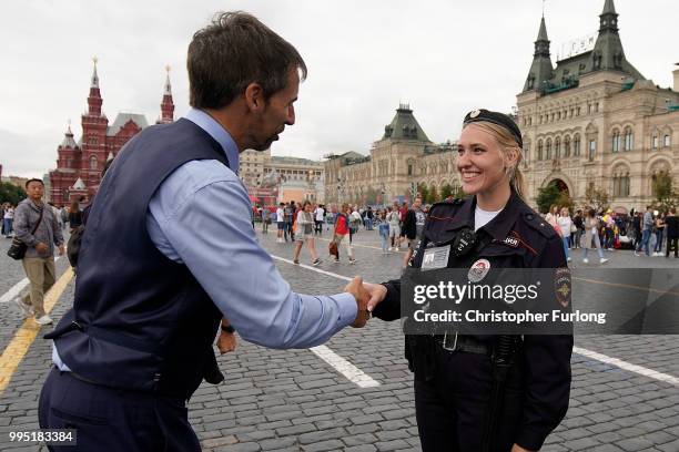 Gareth Southgate lookalike Neil Rowe causes a stir as football fans, TV crews and tourists mistake him for the real England manager as he tours Red...