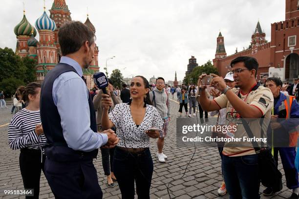 Gareth Southgate lookalike Neil Rowe causes a stir as football fans, TV crews and tourists mistake him for the real England manager as he tours Red...