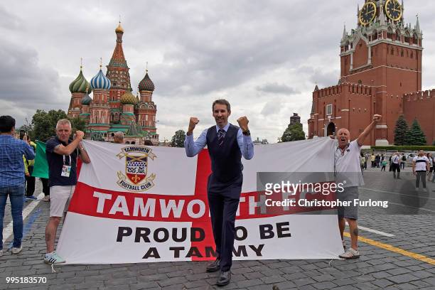 Gareth Southgate lookalike Neil Rowe poses with England fans in Red Square as he causes a stir as football fans, TV crews and tourists mistake him...