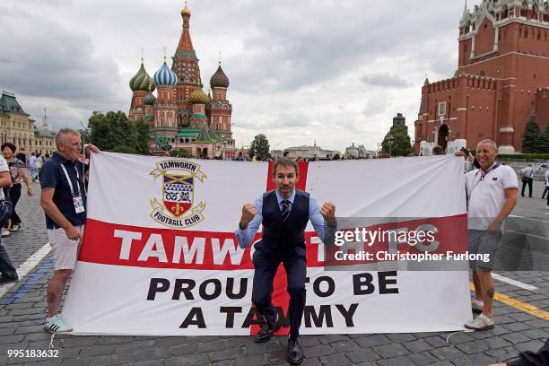 Gareth Southgate lookalike Neil Rowe poses with England fans in Red Square as he causes a stir as football fans, TV crews and tourists mistake him...