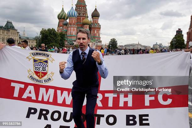 Gareth Southgate lookalike Neil Rowe poses with England fans in Red Square as he causes a stir as football fans, TV crews and tourists mistake him...