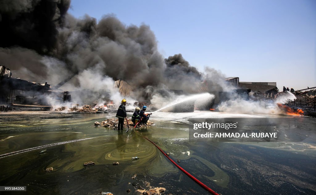 Iraq Fire Engine Iraqi firefighters attempt to put out a fire that broke out due to ...