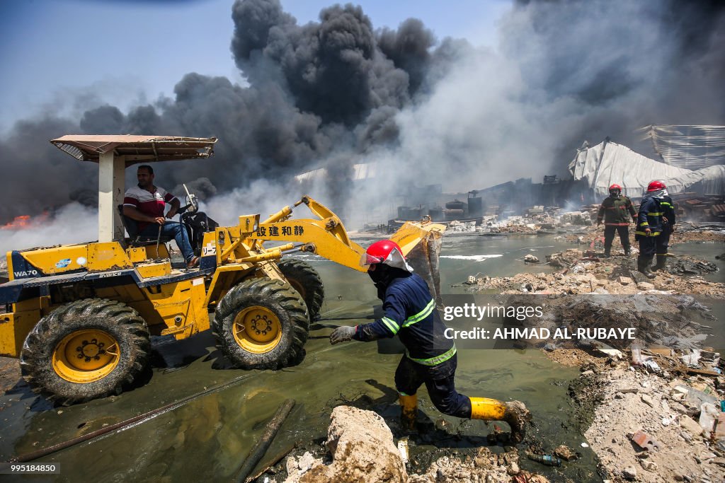 Iraq Fire Engine Iraqi firefighters attempt to put out a fire that broke out due to ...