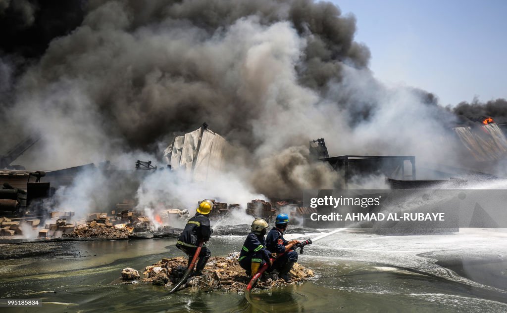 Iraq Fire Engine Iraqi firefighters attempt to put out a fire that broke out due to ...
