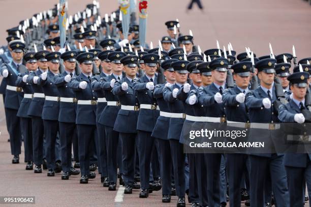 Royal Air Force personnel parade on the Mall toward Buckingham Palace in London on July 10, 2018 during celebrations to mark its centenary. The Queen...