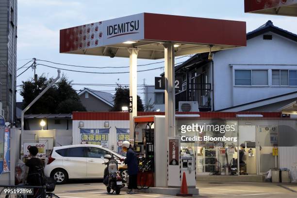 An Idemitsu Kosan Co. Gasoline station stands in Tokyo, Japan, on Tuesday, July 10, 2018. Idemitsu and Showa Shell Sekiyu K.K. Both surged after...