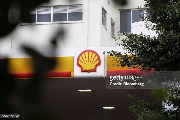 The Showa Shell Sekiyu K.K. Logo is displayed atop the company's gasoline station in Tokyo, Japan, on Tuesday, July 10, 2018. Showa Shell and...