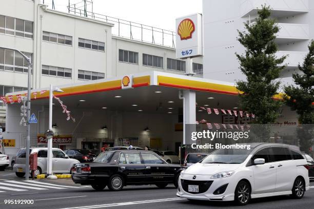 Showa Shell Sekiyu K.K. Gasoline station stands in Tokyo, Japan, on Tuesday, July 10, 2018. Showa Shell and Idemitsu Kosan Co. Both surged after...