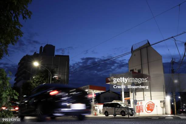 An Idemitsu Kosan Co. Gasoline station stands at dusk in Tokyo, Japan, on Tuesday, July 10, 2018. Idemitsu and Showa Shell Sekiyu K.K. Both surged...