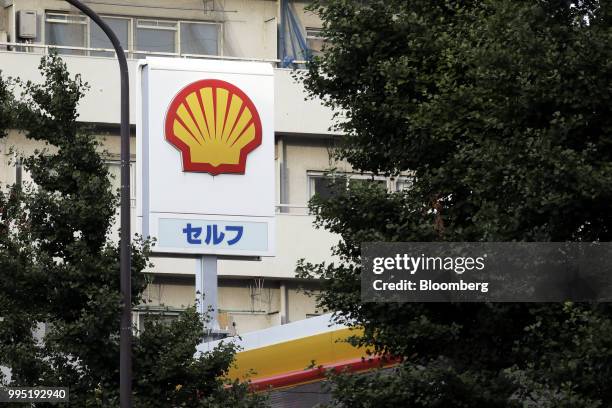 The Showa Shell Sekiyu K.K. Logo is displayed atop the company's gasoline station in Tokyo, Japan, on Tuesday, July 10, 2018. Showa Shell and...