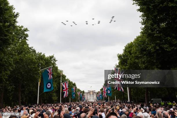 Tens of thousands of spectators gathered along The Mall in central London to watch a flypast of Typhoon fighter jets forming number 100 to celebrate...