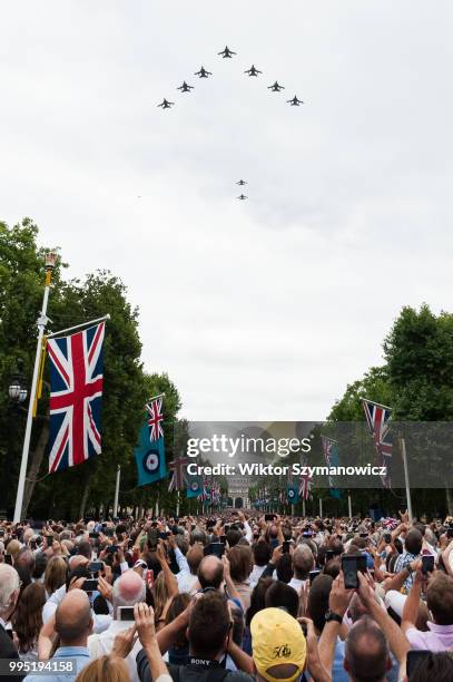 Tens of thousands of spectators gathered along The Mall in central London to watch a flypast of 100 aircaft to celebrate centenary of the...