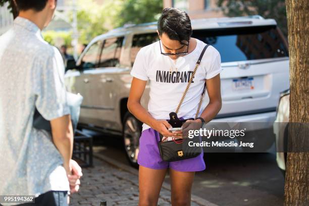 Guest wear an "Immigrante" tshirt during New York Fashion Week Mens Spring/Summer 2019 on July 9, 2018 in New York City.