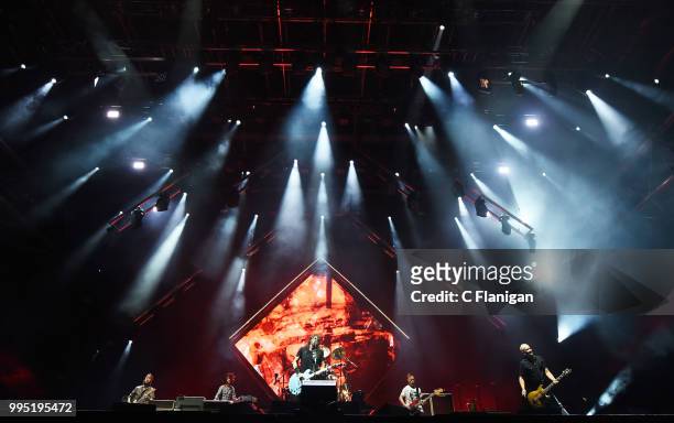 Chris Shiflett, Rami Jaffee, Taylor Hawkins, Dave Grohl, Pat Smear and Nate Mendel of the Foo Fighters perform during the 51st Festival d'ete de...