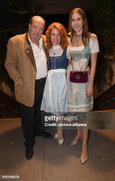 The composer Ralph Siegel his partner Laura Kaefer and his daughter Alana Siegel can be seen at the Bavarian Oktoberfest in Munich, Germany, 23...