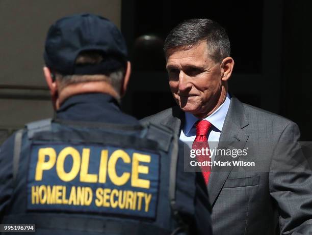 Michael Flynn, former national security advisor to U.S. President Donald Trump, walks out of the E. Barrett Prettyman Federal Courthouse after a...