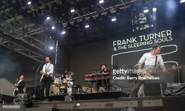 Frank Turner performs with band members of Frank Turner and The Sleeping Souls at the Festival dété de Québec on July 9, 2018 in Queandec City,...