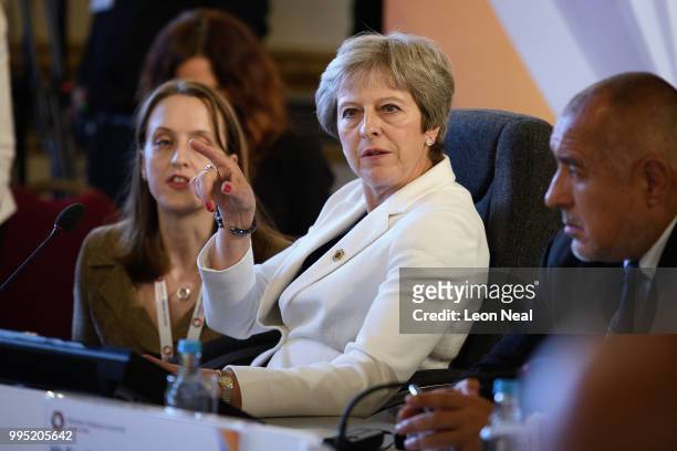 Britain's Prime Minister Theresa May leads a plenary session during the Western Balkans Summit 2018 at Lancaster House on July 10, 2018 in London,...