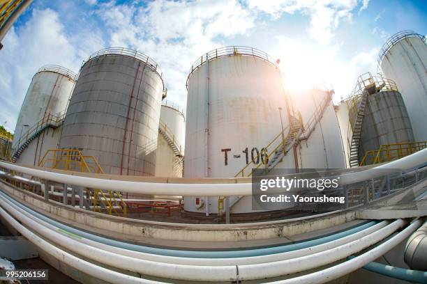 fisheye view of large white industrial tanks for petrol and oil - yaorusheng stock pictures, royalty-free photos & images