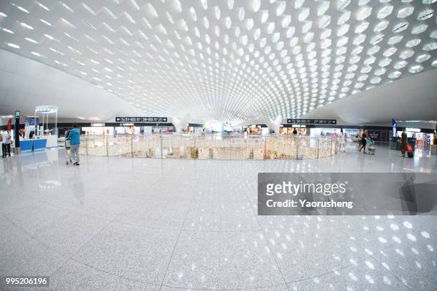 unidentified passenger walking in modern shenzhen  airport,china - concourse stock pictures, royalty-free photos & images