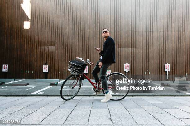 tourist in japan - asian cycling stock pictures, royalty-free photos & images