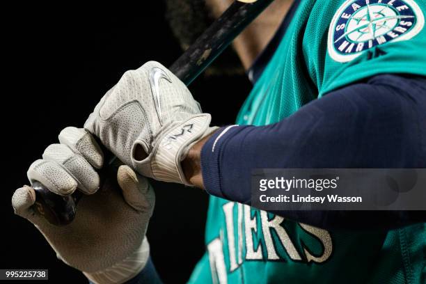 Denard Span of the Seattle Mariners wears Nike MVP batting gloves on deck in the eighth inning against the Colorado Rockies at Safeco Field on July...