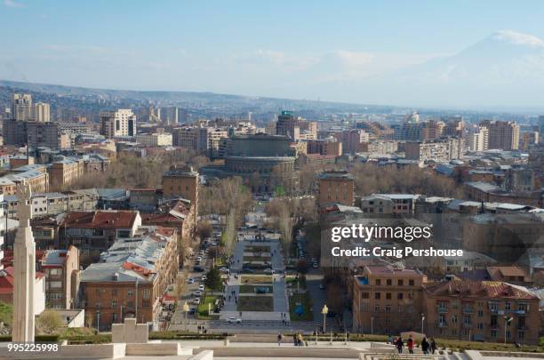 view over yerevan from the cascade, with mt ararat behind. - dormant volcano stock-fotos und bilder